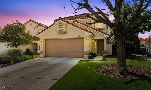9409 Kayla Ct, Las Vegas, NV 89134 - mediterranean / spanish-style house featuring an attached garage, a tile roof, driveway, stucco siding, and a front yard