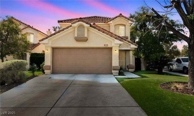 9409 Kayla Ct, Las Vegas, NV 89134 - mediterranean / spanish home featuring stucco siding, a tile roof, driveway, and a garage