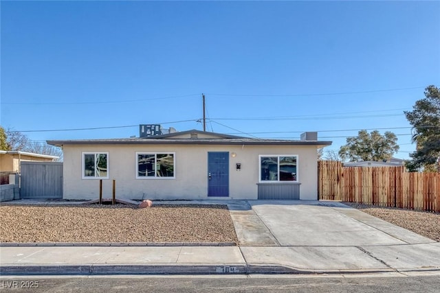 view of front of property with stucco siding and fence