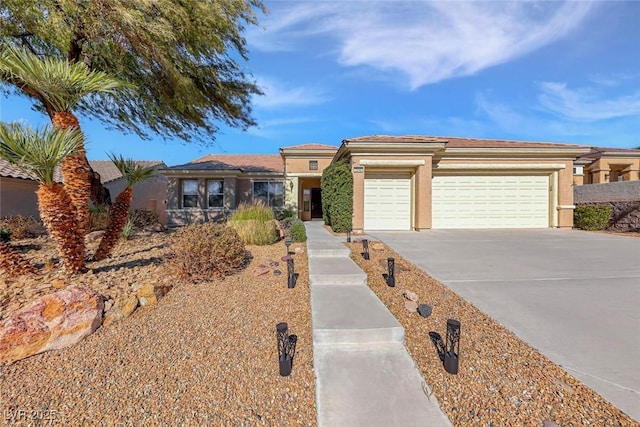2540 Thatcher Ave, Henderson, NV 89052 - prairie-style home featuring driveway, an attached garage, and stucco siding