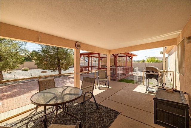 view of patio / terrace with outdoor dining space and a fenced backyard
