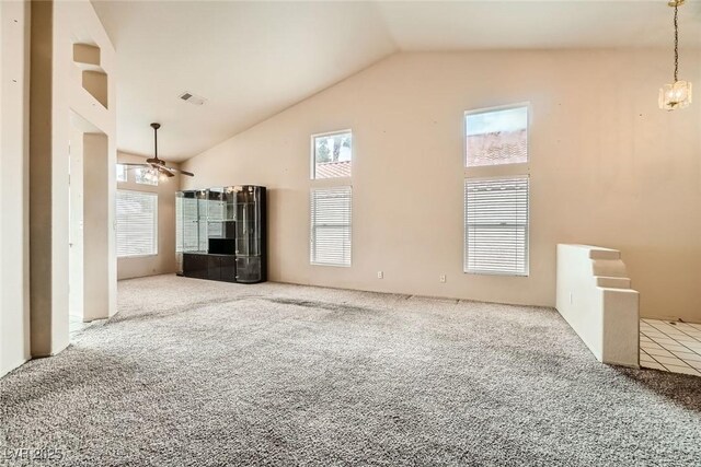 9532 Calico Garden Ave, Las Vegas, NV 89134 - unfurnished living room featuring carpet floors, lofted ceiling, and a ceiling fan