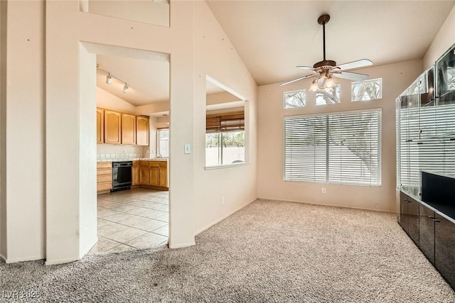 9532 Calico Garden Ave, Las Vegas, NV 89134 - unfurnished living room with light colored carpet, lofted ceiling, a ceiling fan, and baseboards
