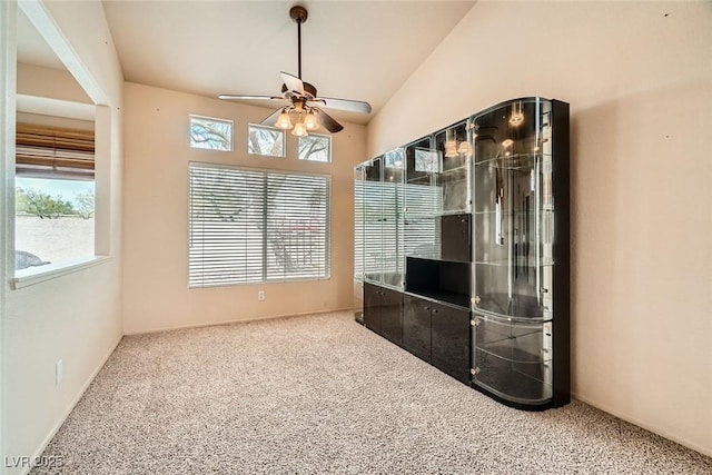 9532 Calico Garden Ave, Las Vegas, NV 89134 - unfurnished dining area featuring carpet floors, ceiling fan, plenty of natural light, and vaulted ceiling