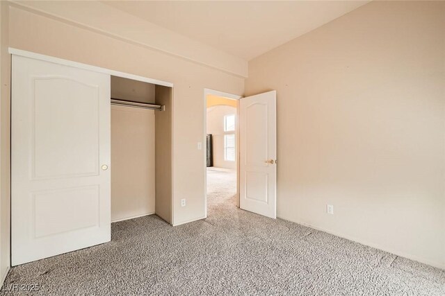 9532 Calico Garden Ave, Las Vegas, NV 89134 - unfurnished bedroom featuring light colored carpet and a closet
