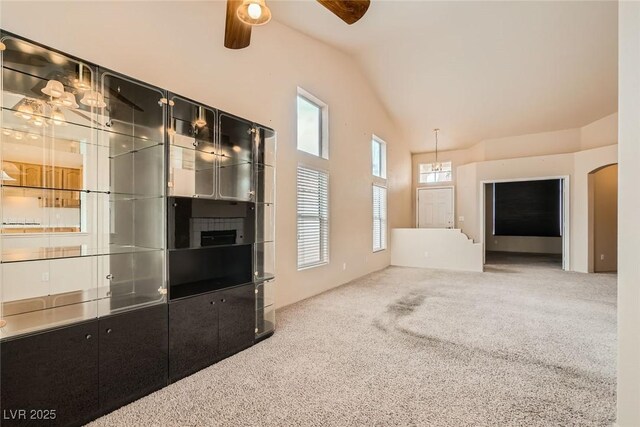 9532 Calico Garden Ave, Las Vegas, NV 89134 - unfurnished living room with carpet flooring, a ceiling fan, and lofted ceiling