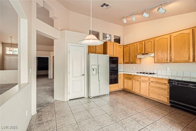 9532 Calico Garden Ave, Las Vegas, NV 89134 - kitchen featuring black appliances, track lighting, light tile patterned flooring, and tile countertops