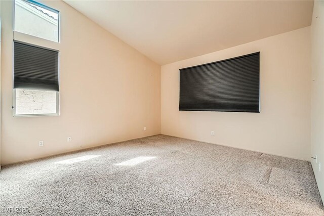9532 Calico Garden Ave, Las Vegas, NV 89134 - empty room featuring carpet and lofted ceiling
