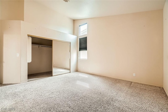 9532 Calico Garden Ave, Las Vegas, NV 89134 - unfurnished bedroom with carpet floors, a closet, and a towering ceiling