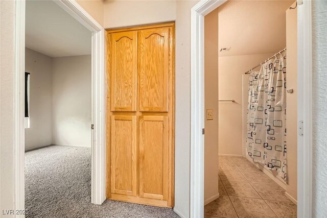 9532 Calico Garden Ave, Las Vegas, NV 89134 - bathroom with tile patterned flooring and a shower with shower curtain