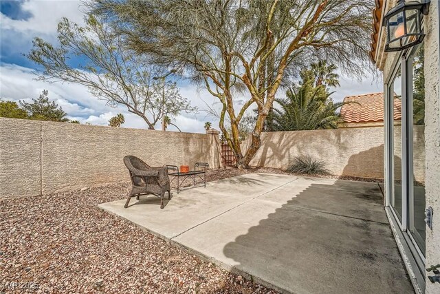 9532 Calico Garden Ave, Las Vegas, NV 89134 - fenced backyard featuring a patio