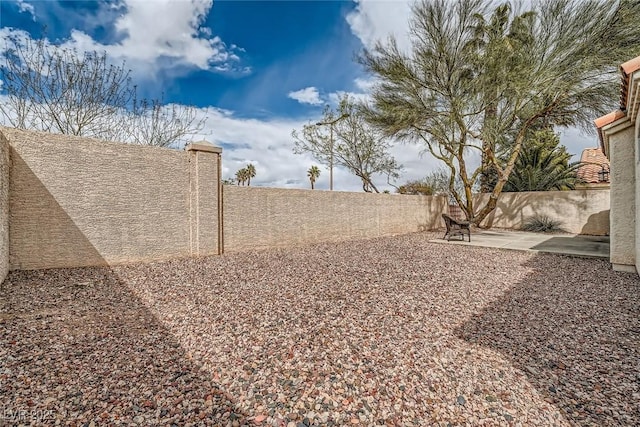 9532 Calico Garden Ave, Las Vegas, NV 89134 - fenced backyard with a patio