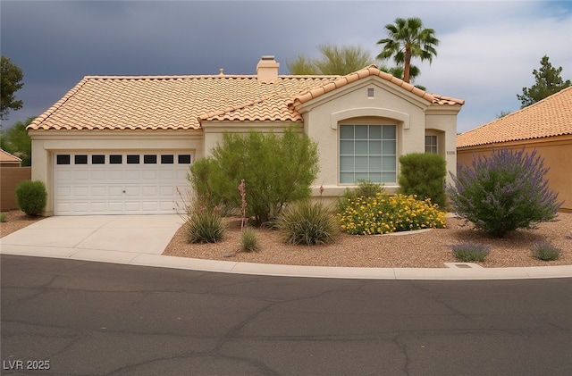 9532 Calico Garden Ave, Las Vegas, NV 89134 - mediterranean / spanish-style home featuring a tile roof, a chimney, driveway, stucco siding, and an attached garage