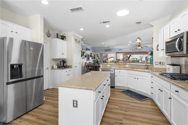 2606 Crested Butte St, Henderson, NV 89052 - kitchen featuring a sink, appliances with stainless steel finishes, ceiling fan, and visible vents
