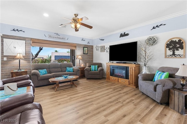 2606 Crested Butte St, Henderson, NV 89052 - living area featuring crown molding, light wood finished floors, and ceiling fan