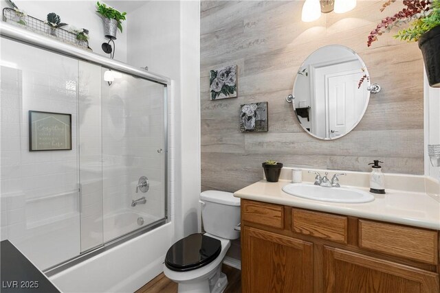 2606 Crested Butte St, Henderson, NV 89052 - full bathroom featuring vanity, bath / shower combo with glass door, and toilet