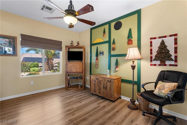 2606 Crested Butte St, Henderson, NV 89052 - sitting room with baseboards, a ceiling fan, wood finished floors, and visible vents