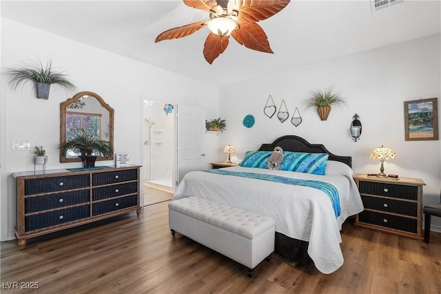 2606 Crested Butte St, Henderson, NV 89052 - bedroom featuring connected bathroom, ceiling fan, visible vents, and wood finished floors