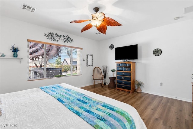 2606 Crested Butte St, Henderson, NV 89052 - bedroom featuring baseboards, a ceiling fan, wood finished floors, and visible vents