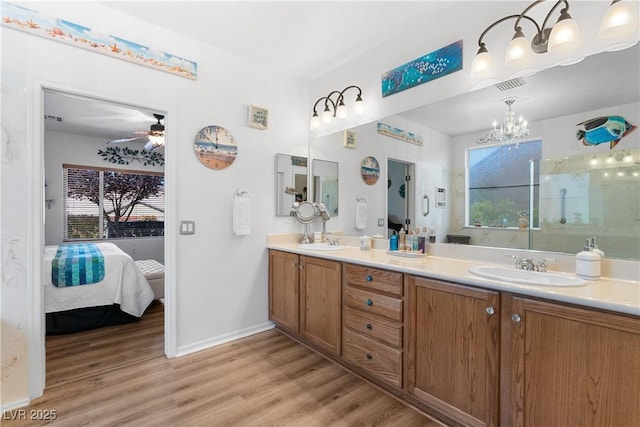 2606 Crested Butte St, Henderson, NV 89052 - bathroom with plenty of natural light, a sink, and wood finished floors