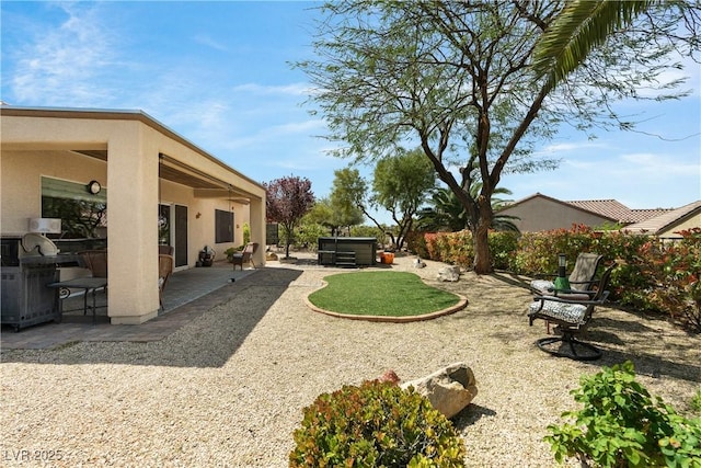 2606 Crested Butte St, Henderson, NV 89052 - view of yard featuring a jacuzzi and a patio area