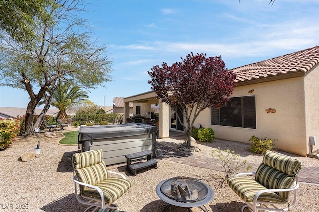 2606 Crested Butte St, Henderson, NV 89052 - view of patio featuring a hot tub and an outdoor fire pit