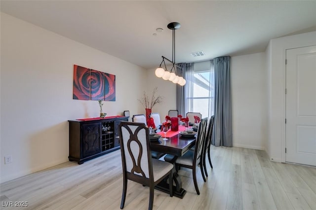 8637 Home Gate Ct, Las Vegas, NV 89113 - dining room featuring light wood-type flooring and baseboards
