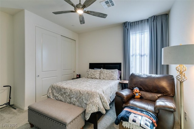 8637 Home Gate Ct, Las Vegas, NV 89113 - bedroom with light colored carpet, a closet, and a ceiling fan
