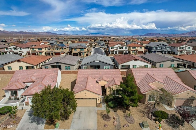 7460 Chaffinch St, North Las Vegas, NV 89084 - aerial perspective of suburban area featuring a mountainous background