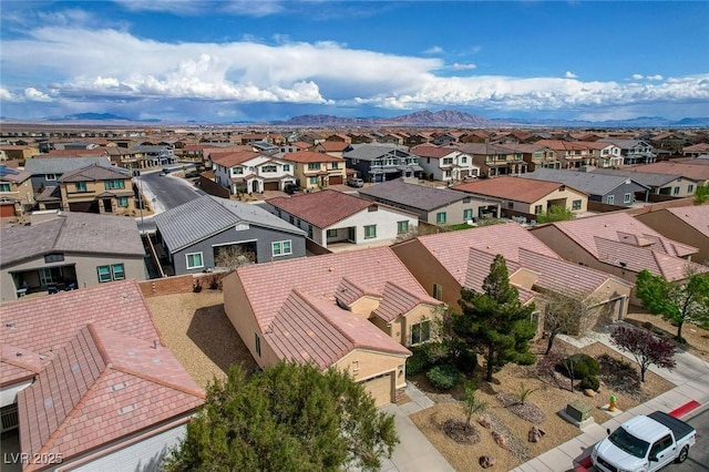 7460 Chaffinch St, North Las Vegas, NV 89084 - aerial perspective of suburban area featuring a mountainous background