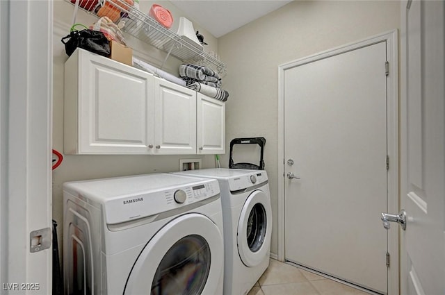 7460 Chaffinch St, North Las Vegas, NV 89084 - laundry room featuring washing machine and dryer, cabinet space, and light tile patterned floors