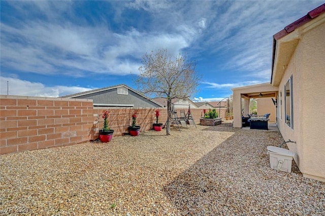 7460 Chaffinch St, North Las Vegas, NV 89084 - fenced backyard featuring a patio area