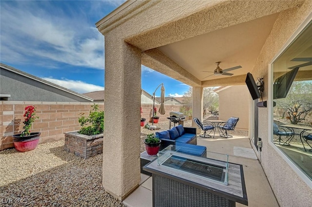 7460 Chaffinch St, North Las Vegas, NV 89084 - view of patio / terrace featuring a ceiling fan, a fenced backyard, area for grilling, and an outdoor fire pit