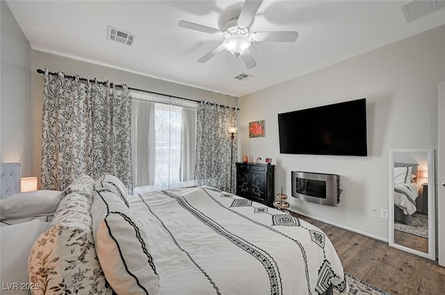 7460 Chaffinch St, North Las Vegas, NV 89084 - bedroom with wood finished floors and a ceiling fan