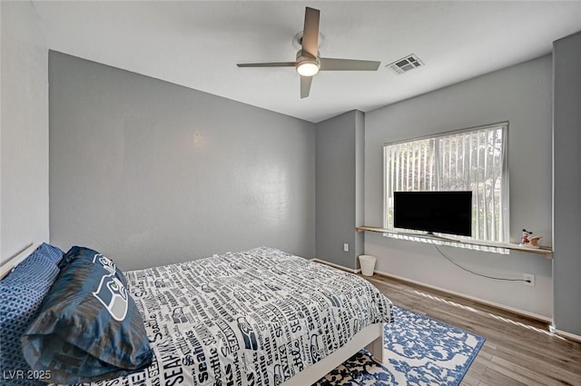 7460 Chaffinch St, North Las Vegas, NV 89084 - bedroom featuring wood finished floors, baseboards, and ceiling fan