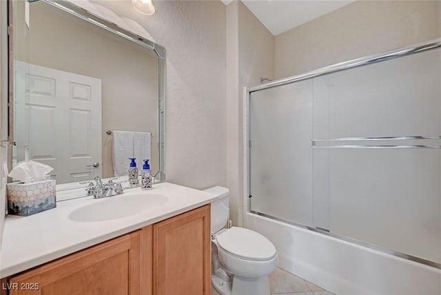 7460 Chaffinch St, North Las Vegas, NV 89084 - full bath with toilet, vanity, combined bath / shower with glass door, and tile patterned flooring