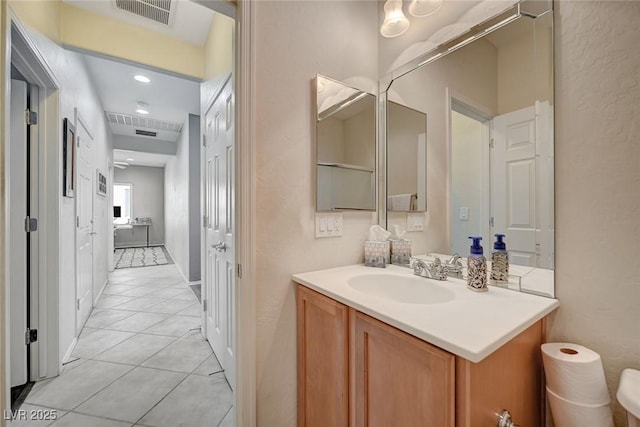 7460 Chaffinch St, North Las Vegas, NV 89084 - bathroom featuring tile patterned flooring and vanity