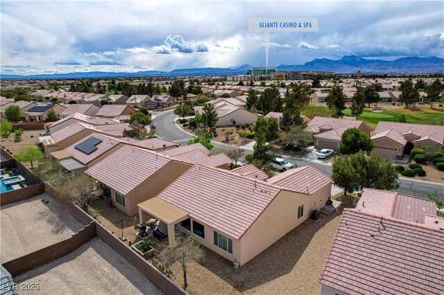 7460 Chaffinch St, North Las Vegas, NV 89084 - aerial perspective of suburban area featuring a mountainous background