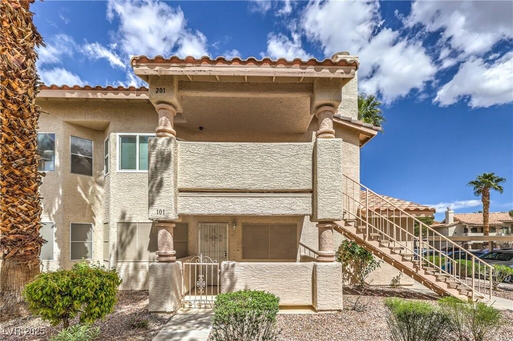 925 Boulder Mesa Dr Unit 101, Las Vegas, NV 89128 - exterior space with stucco siding and stairs