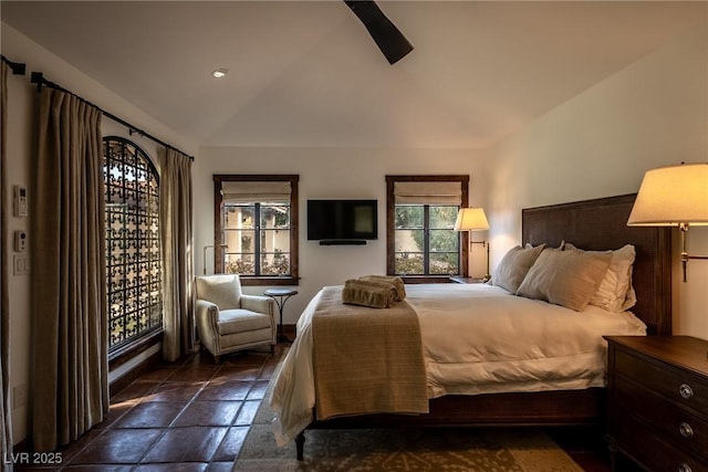 bedroom with lofted ceiling and a ceiling fan