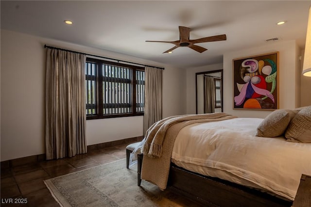 bedroom with recessed lighting, ceiling fan, and dark tile patterned floors