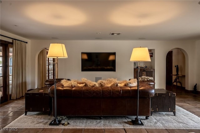living area with arched walkways