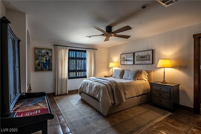 bedroom with baseboards and ceiling fan