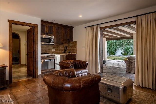 living area featuring recessed lighting and arched walkways