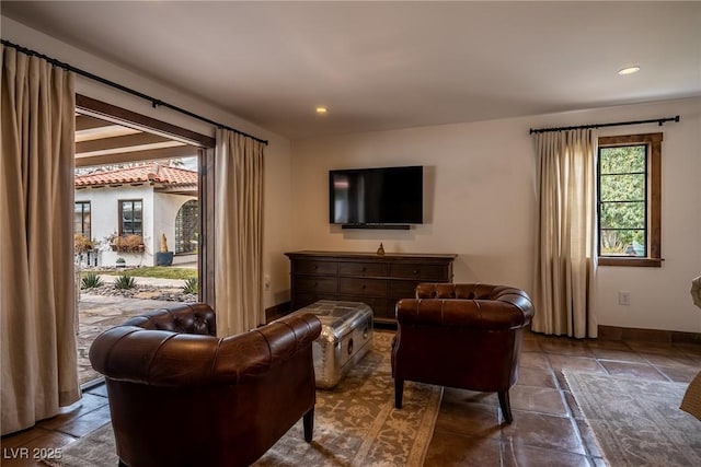 living area with baseboards, recessed lighting, and tile patterned floors
