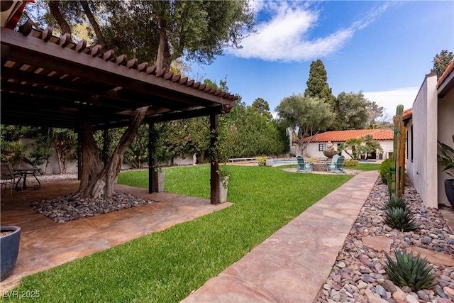 view of green lawn featuring a swimming pool, a pergola, and a patio area
