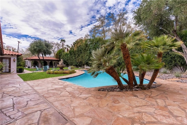 outdoor pool with a patio area and a gazebo