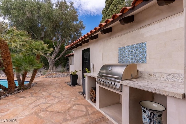 view of patio featuring a grill and area for grilling