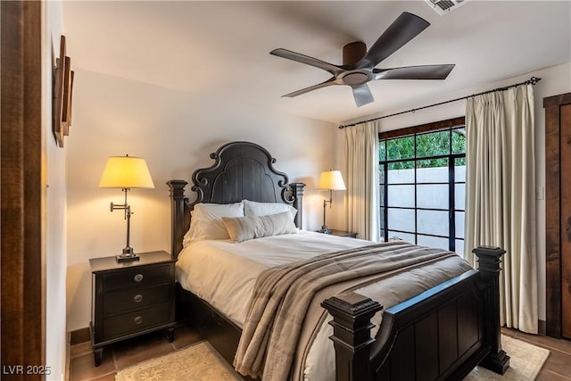 bedroom featuring light tile patterned floors and ceiling fan