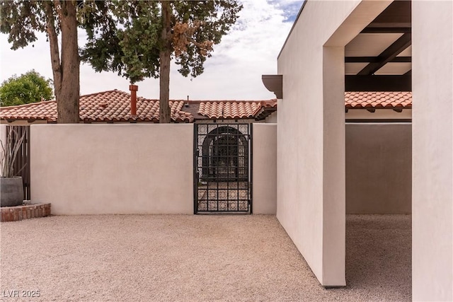 view of patio / terrace with a gate and fence